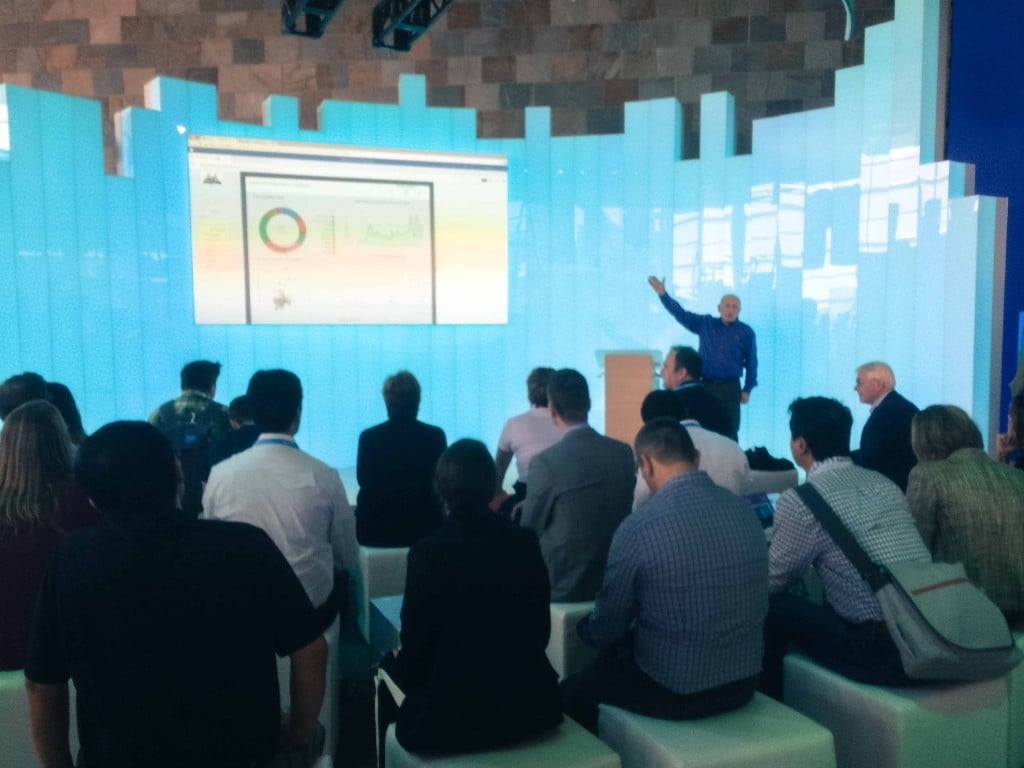 Rootstock COO and Senior Vice President Chuck Olinger provides presentation to standing room audience including Jan Baan (far right).